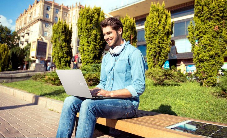 male student with a laptop 